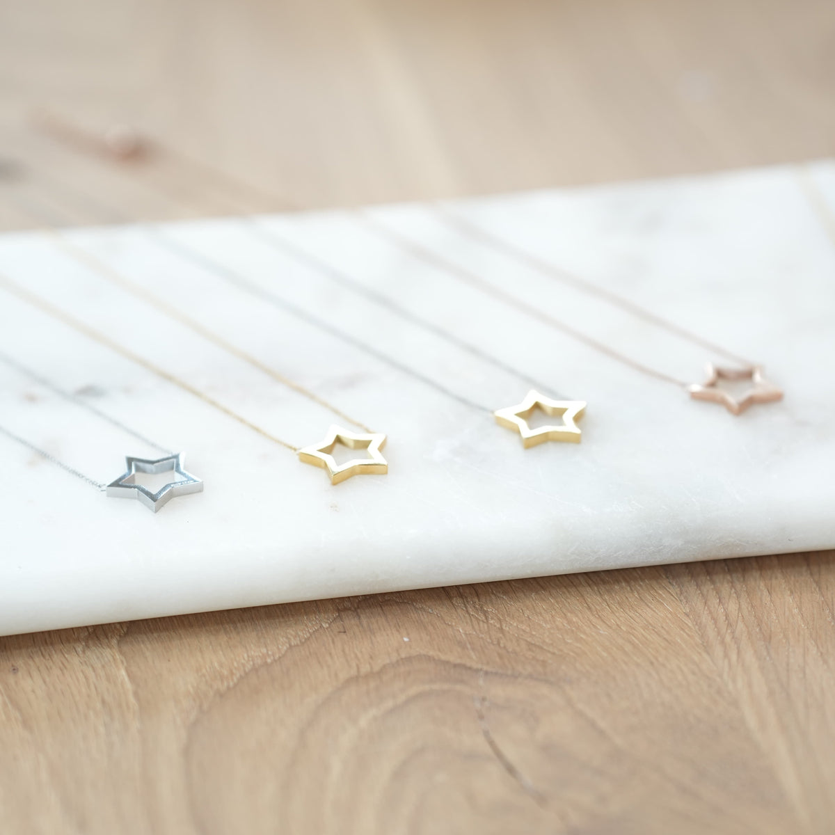 issy star pendant necklaces 