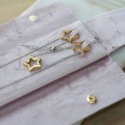 pink velvet jewellery pouch with issy star jewellery inside 