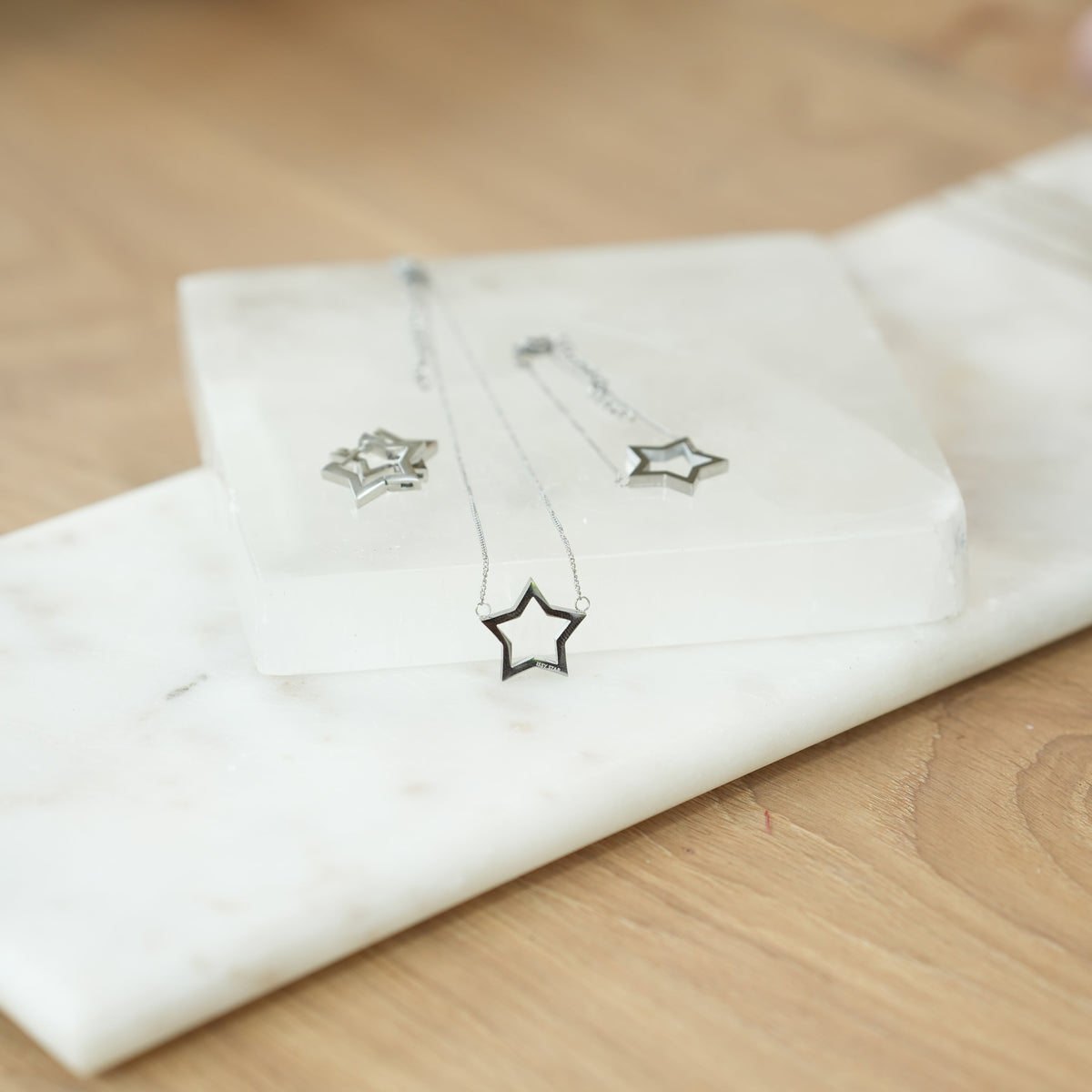 silver star necklace earrings and bracelet 